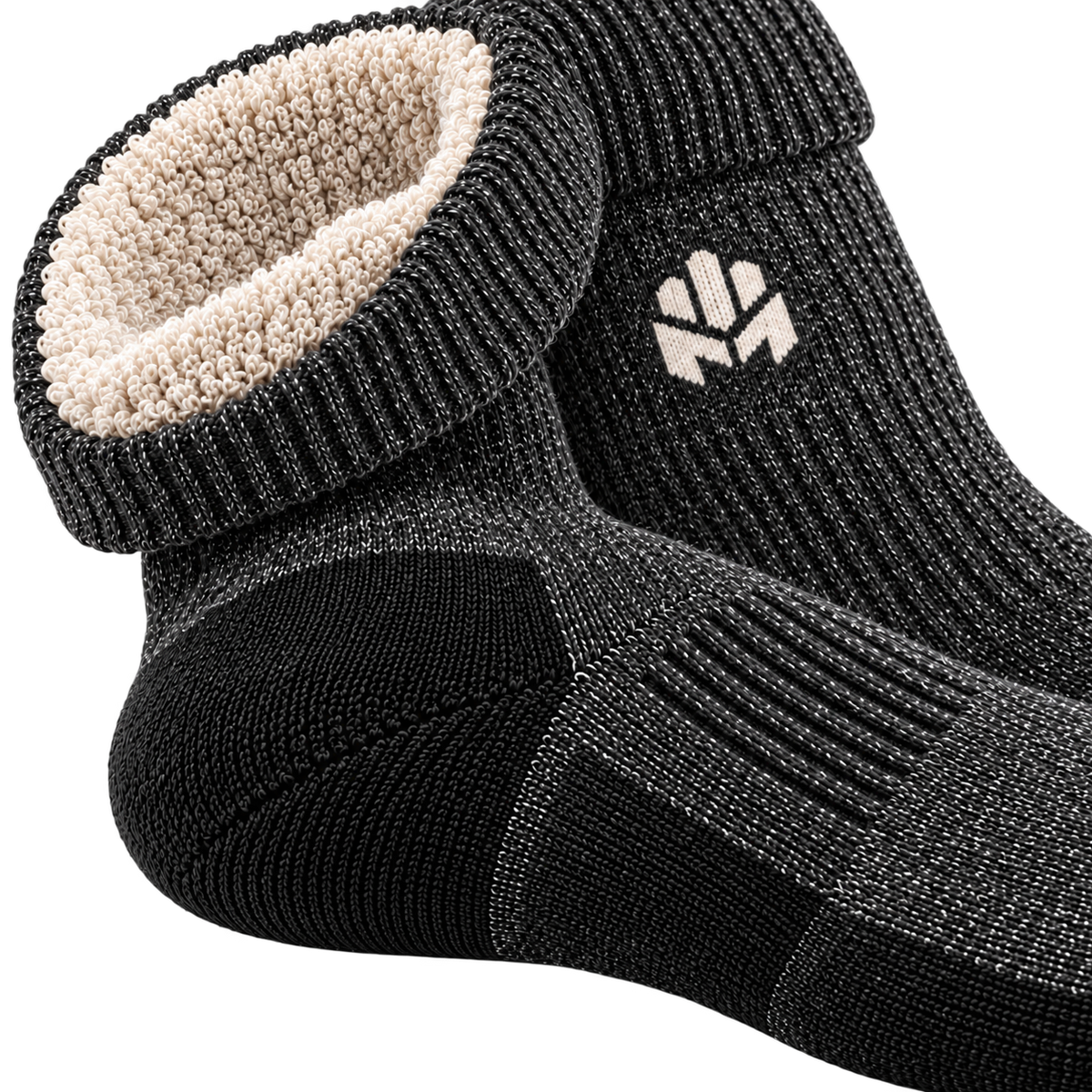 Close-up of the MITTSWELL sock concept showing dense terry insulation, ribbed arch and reinforced heel knit.
